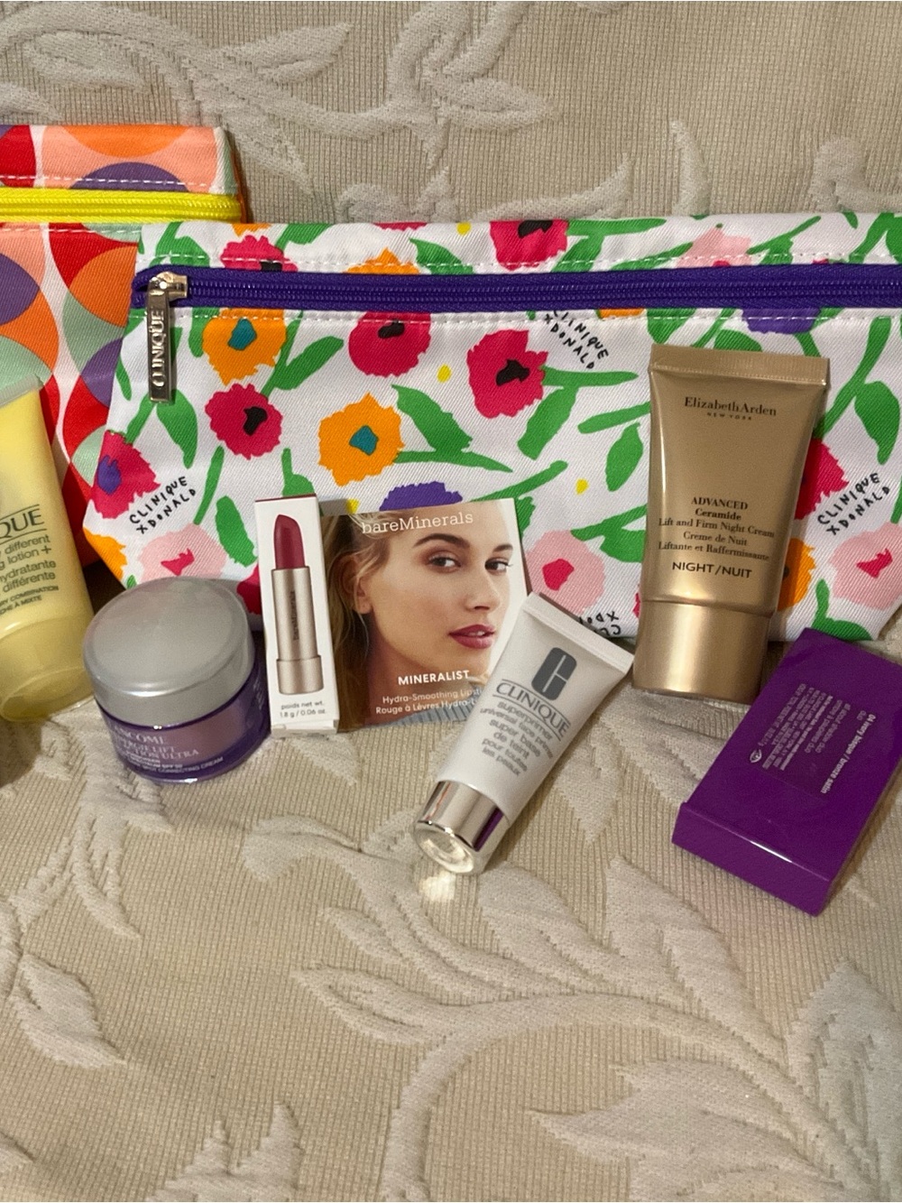 Assorted sample items from Clinique, Lancome, Estée Lauder and BareMinerals.